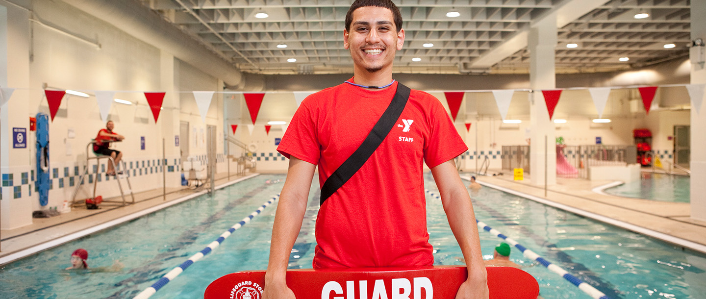 Lifeguard working at a YMCA pool in Brooklyn