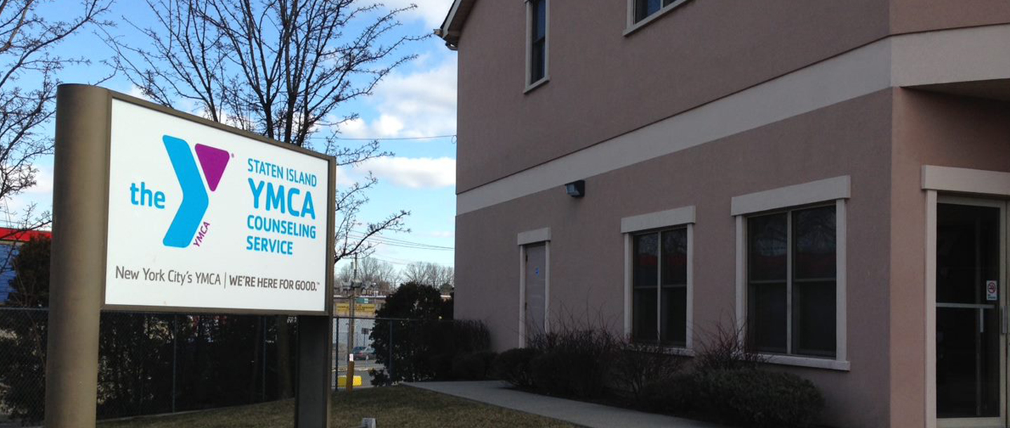 Exterior of a house with Y Counseling Service sign outside.