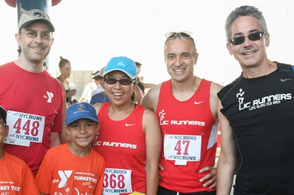 A family participates in a YMCA running event.