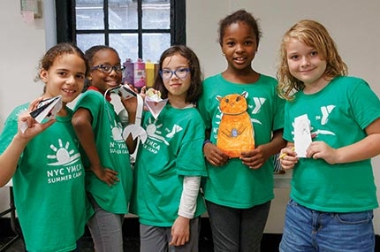Summer campers with arts and crafts