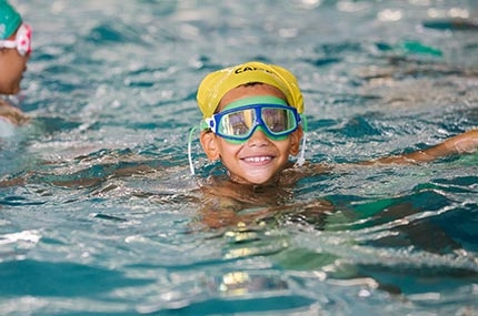 Boy swimming at Castle Hill YMCA indoor pool