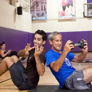 Partner work at YMCA group fitness class