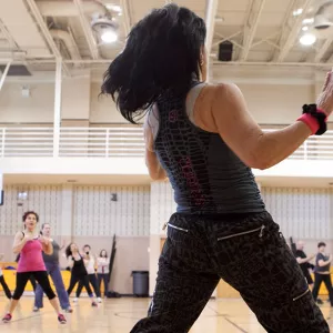 Group exercise instructor teaches YMCA fitness class