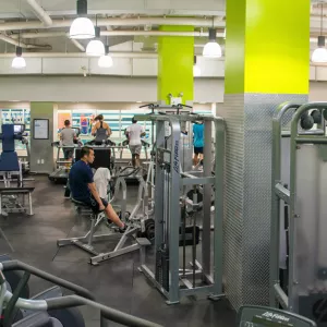 Strength training and cardio equipment and free weights at the Chinatown YMCA.