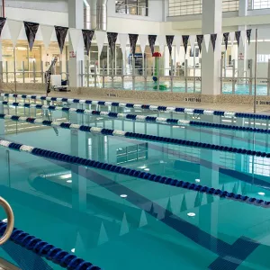 Indoor lap pool and water slide at Rockaway YMCA in Queens