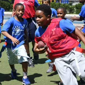 Y campers playing flag football