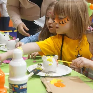 Kids doing arts and crafts at free YMCA event for families