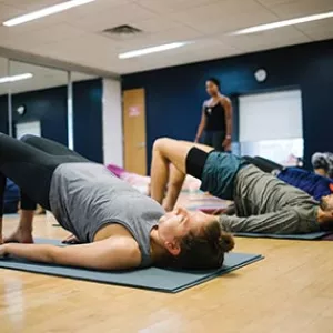 Yoga class doing bridge pose