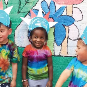 Kids wearing tie dye tee shirts at the Flushing YMCA summer camp.