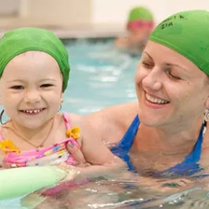 Mom and baby swim in YMCA pool