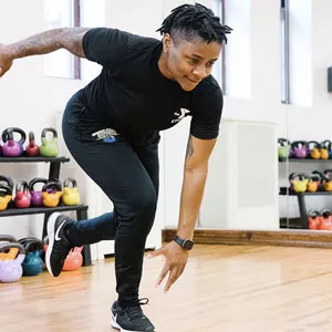 A YMCA instructor demonstrates exercises for strength and conditioning.