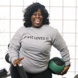 Woman smiling in the Y fitness center